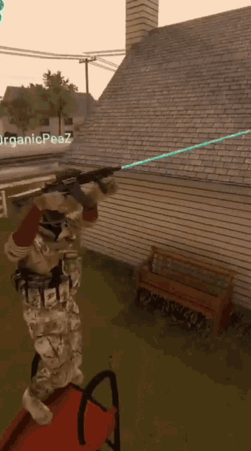 a person holding a rifle in front of a house with organicpeaz written on the bottom