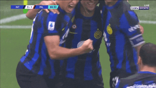 a group of soccer players are celebrating a goal during a game sponsored by bein sports