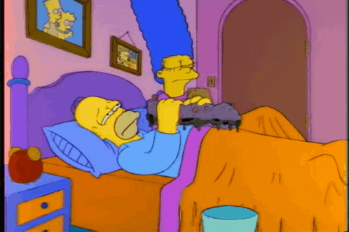 a cartoon of homer simpson and marge simpson laying in a bed