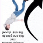 a man is hanging upside down in the air with an arrow pointing to him .