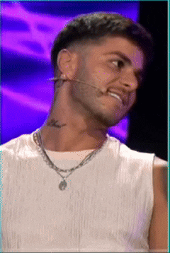 a man with a tattoo on his neck wearing a necklace