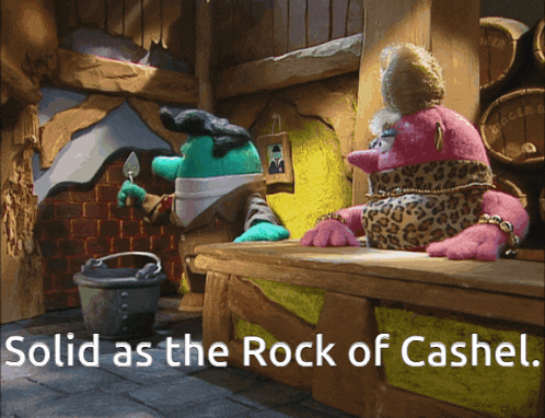 two stuffed animals sit on a bench with the words solid as the rock of cashel above them