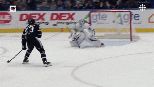 a hockey player with the number 13 on his jersey