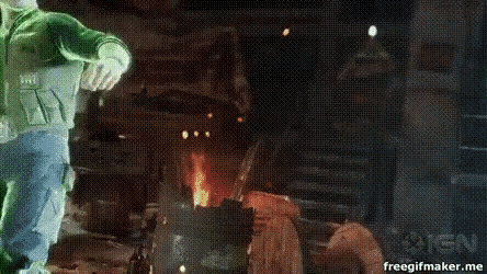 a gif of a man fighting another man with the words ign on the bottom right
