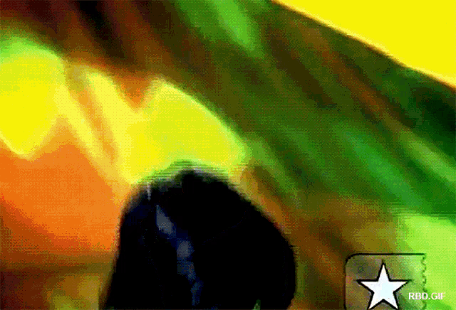 a green and yellow background with a white star in the middle