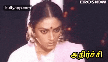 a close up of a woman 's face with the words erosnow written in yellow .