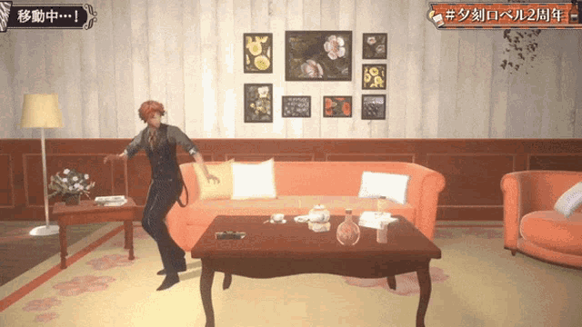 a man in a suit is dancing in a living room with chinese writing on the wall behind him