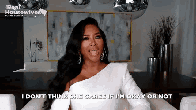 a woman in a white dress says i don t think she cares if i 'm okay or not