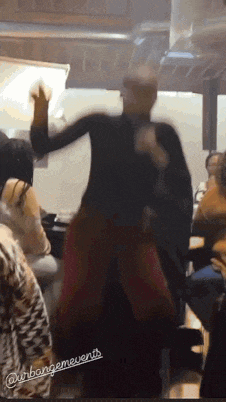 a man is dancing in front of a group of people with the words urbangemevents written on the bottom