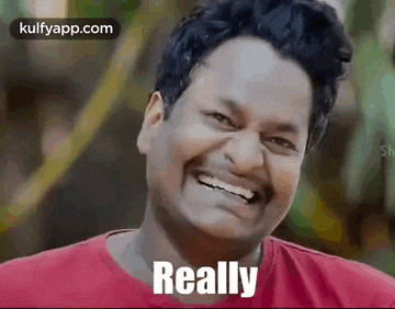 a man is smiling and saying `` really '' .