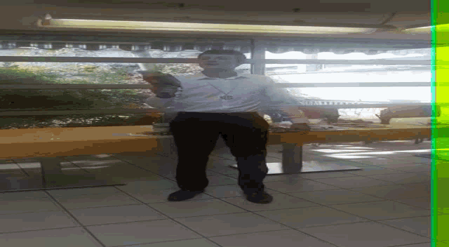 a man in a clown costume is standing in front of a table