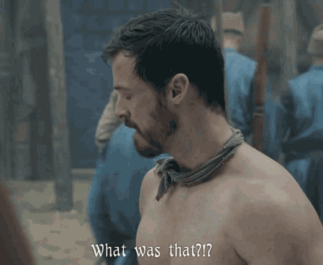 a shirtless man with a bandana around his neck is asking what was that