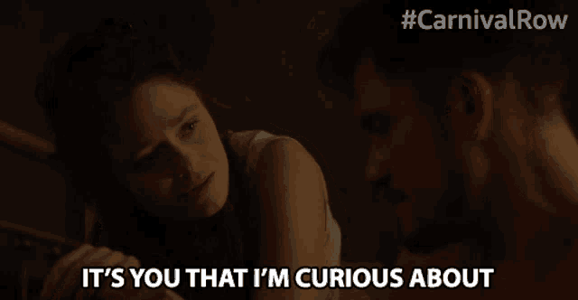 a man and a woman are looking at each other and the woman says it 's you that i 'm curious about