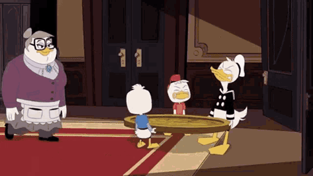 a group of cartoon ducks are standing around a table .