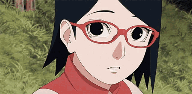 a close up of a cartoon character wearing red glasses .