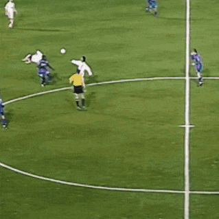 a soccer player with the number 10 on his jersey kicks the ball