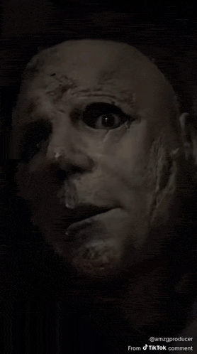 a close up of a man 's face with a mask on .