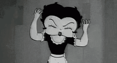 betty boop is a black and white cartoon character in a maid outfit .