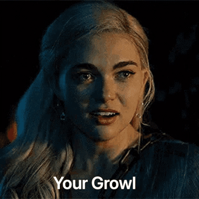 a close up of a woman 's face with the words `` your growl '' written above her .