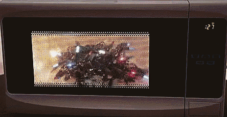 a microwave displays the time as 1:27