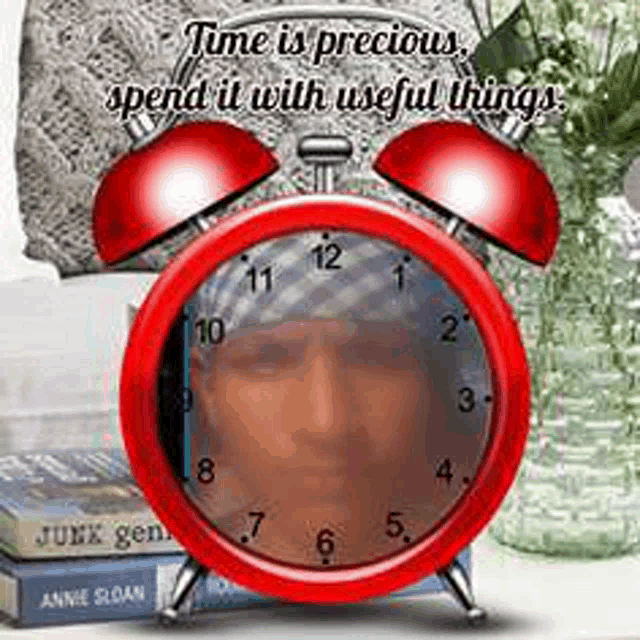 a red alarm clock with the words time is precious spend it with useful things on it