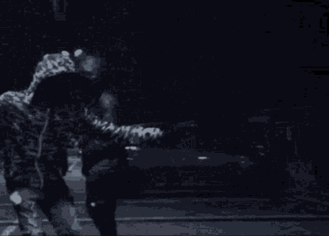 a blurry picture of a person holding a sign that says ' s '
