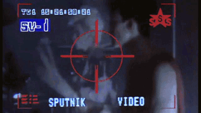 a screen shows a sputnik live video with a crowd in the background
