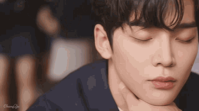a close up of a person 's face with the word chan on the bottom left