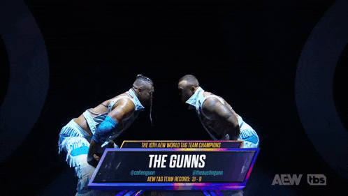 a group of people are standing in front of a screen that says the gunns