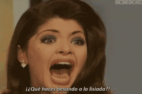 a close up of a woman 's face with the words " qué haces besando a la lisionada " written below it