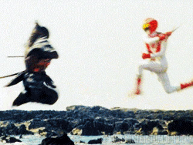 a man in a red and white outfit is jumping in the air next to another man