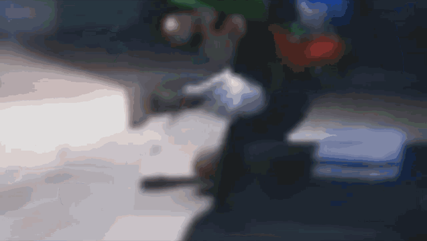 a blurry picture of a person holding a bag