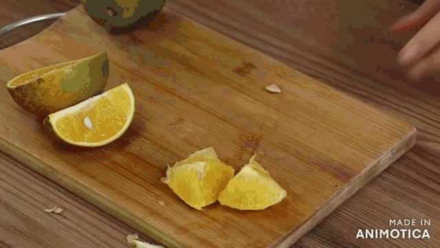 a person holding a bowl of diced oranges and eggs .