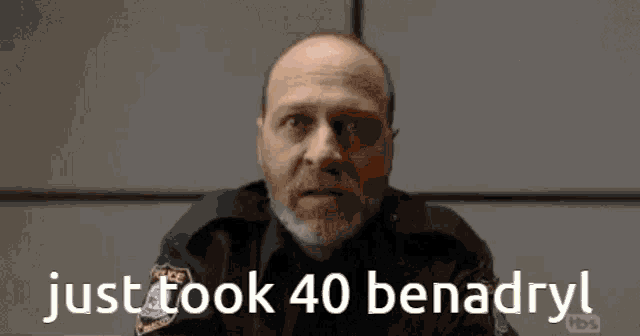 a man in a police uniform says justtook 40 benadryl