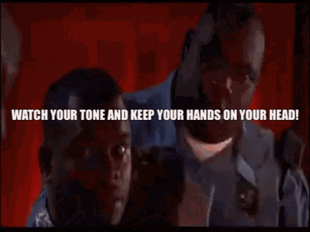 a man is laying on a table with the words " watch your tone and keep your hands on your head " above him