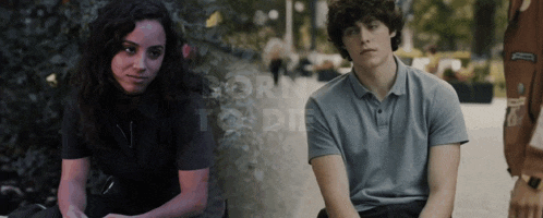 a man and a woman are sitting next to each other and the words born to die are visible behind them