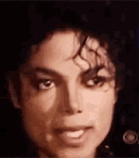 a close up of a man 's face with a cbs logo in the corner