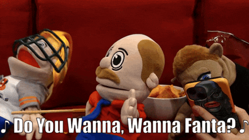 a group of stuffed animals are sitting on a red couch with the words " do you wanna wanna fanta " above them