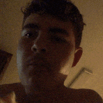 a man without a shirt is taking a selfie with his eyes closed .