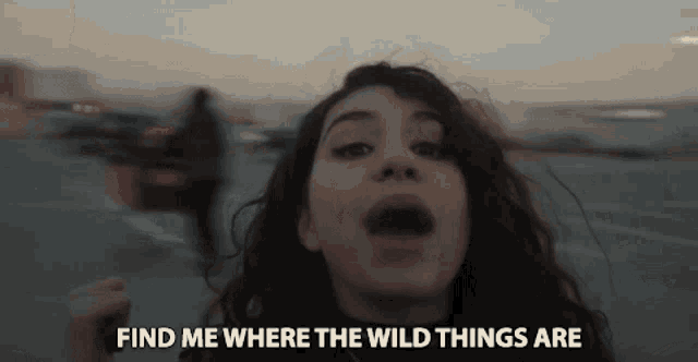 a woman is screaming with the words " find me where the wild things are " behind her