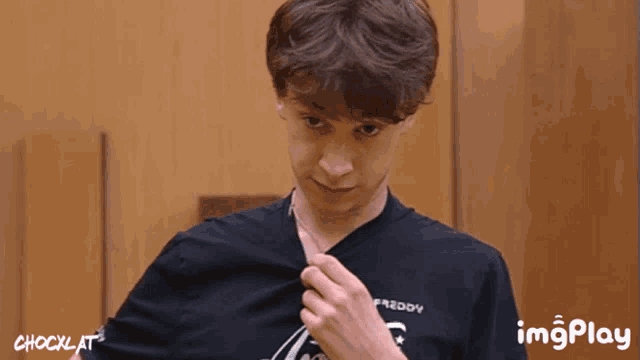 a man wearing a black shirt that says freddy