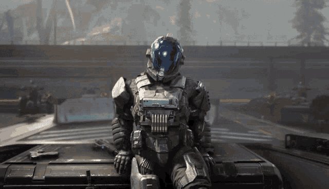 a man in a space suit is sitting on top of a vehicle