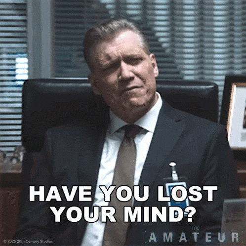 a man in a suit and tie sitting in a chair with the words have you lost your mind