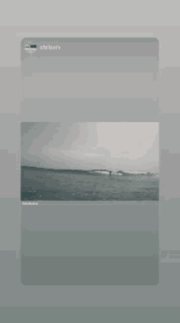 a phone screen shows a picture of a beach and the name chrisberry on the bottom