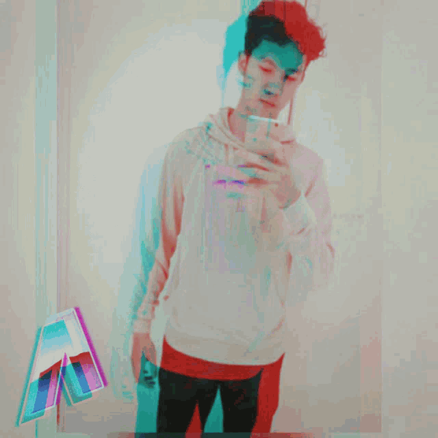 a man taking a picture of himself in a mirror
