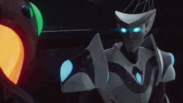 a robot with blue eyes is standing in front of a green light