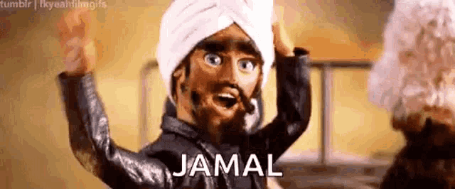 a puppet is wearing a turban and the word jamal is written on the screen .