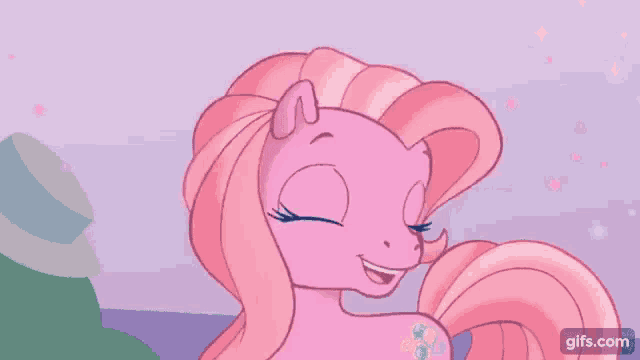 pinkie pie from my little pony is smiling for the camera .