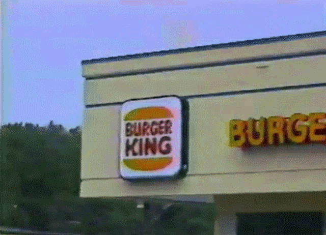 a burger king restaurant with a sign that says burger king