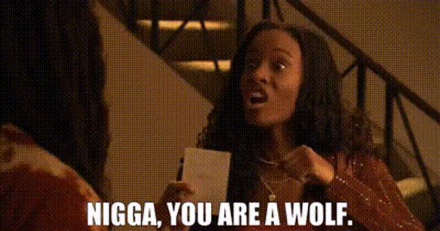 a man with dreadlocks is standing in front of a window and says `` nigga , you are a wolf . ''